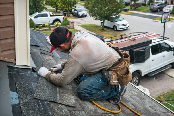 Professional Roof Replacement technician working in Roberts, WI